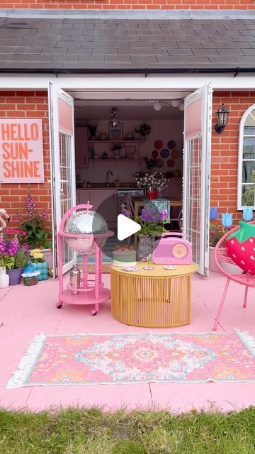 Kate Hielema Morgan on Instagram: "I will forever and always paint my garden patio pink 🩷🌸🌷💖 It’s a vibe I will never leave behind 😂   I also want to say a huge thank you to @yardart_uk and @burntpeach.design for sending me this amazing “hello sunshine” outdoor artwork! It’s so nice to finally have some art that can stay outside in the garden 😍  #gardendesign #pinkgarden #paintedpatio #diygarden #gardendecor #backyardgarden #diyhomedecor #pinkpinkpink #pinkaesthetic #homesweethome" Eclectic Outdoor Patio, Outdoor Artwork, Pink Furniture, Painted Patio, Babe Cave, Forever And Always, Woman Cave, Pink Garden, Leave Behind