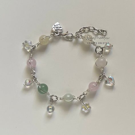 "Handmade Dreamy Bracelet ✿ Made with glass crystal beads, Quartz, rose Quartz, jade, and metal accents ✿ Colors: Silver, blush pink, milky white, pale yellow, fern green, and iridescent clear ✿ The bracelet has an additional 1-1.5\" of extension chain" Rock Bracelets Stones, Green And White Bracelet, Silver Beads Bracelet, Dreamy Bracelet, Metal Bead Bracelet, Diy Jewelry Rings, Pretty Jewelry Necklaces, Estilo Taylor Swift, Bracelets Design