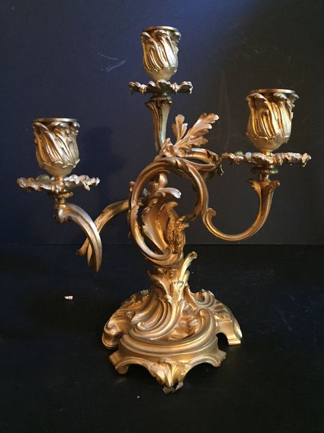 "This stunning sculptural pair of 19th Century gilt bronze Louis XV style candelabras has three candle holders each. The base features beautifully formed curling floral leaf branches which rise to hold the candle cups. The bronze design and casting is spectacularly executed. This pair has the best fire gilding possible and is among the highest quality. Condition : One bobeche is missing. (pictured) Otherwise perfect. Size: H 10\" x W 8 ½\" x D 5\" each Free Shipping for all Domestic Orders INCLU Golden Candle Holders, Antique Candle Holders Vintage, Diy Lantern Lights, French Antique Decor, Candle Opera, Tuscan Candles, Fancy Candle Holders, Antique Candle Holders, Victorian Candles