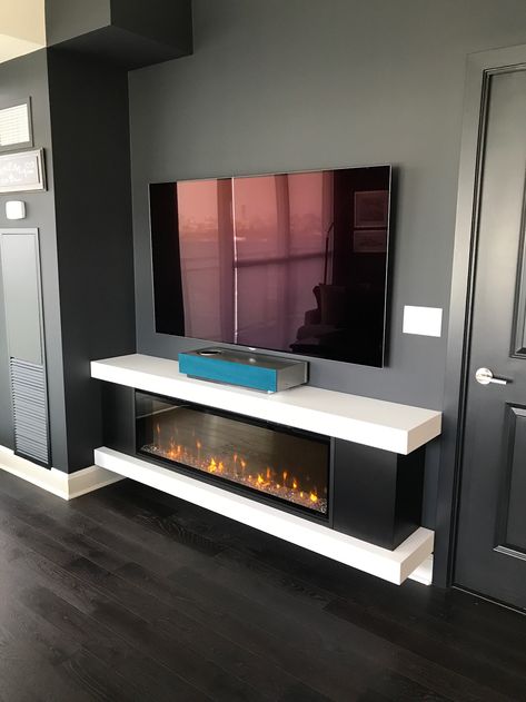 Custom Cabinet with a regular Electric Fireplace. Private Residence Toronto. Fireplace with TV above. Concealed Television, Tv Camino, Tv Fal, Tv Walls, Tv Mounting, Fire Design, Tv Stand Designs, Mounted Fireplace, Fireplace Tv Wall