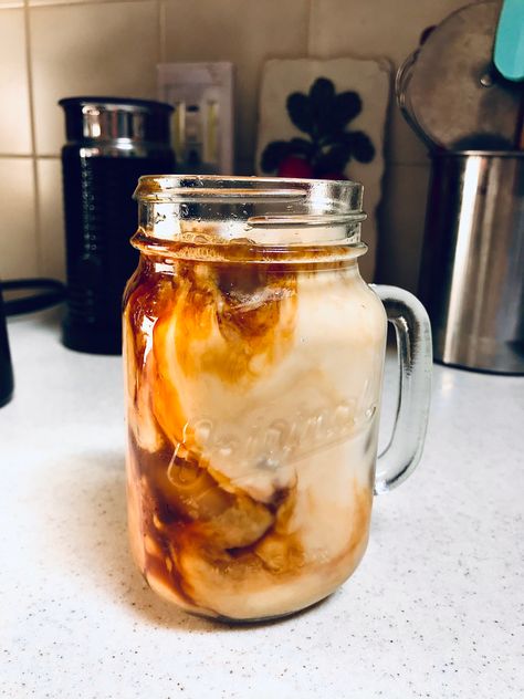 Iced coffee in a mason jar with milk mixing in Mason Jar Iced Coffee, Mason Jar Coffee Mug, Mason Jar Coffee Aesthetic, Coffee In Mason Jar, Mason Jar Aesthetic, Iced Coffee Mason Jar, Mason Jar Coffee, Deja Brew, Energy Juice