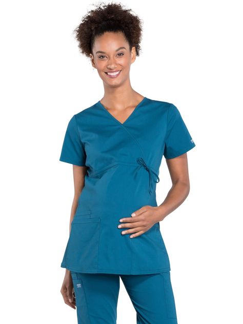 PRICES MAY VARY. V-NECK STYLING - These v-neck womens scrub tops offer healthcare workers a uniform that is professional, stretchy, and comfortable. LOTS OF STORAGE - Our maternity scrub shirt for women features three roomy front pockets to store all your essential items. Which consists of two patch pockets and a cell phone pocket. STYLE AND FUNCTION - Our women's scrubs offer medical personnel a uniform that is professional, hardworking, and stylish. This mock wrap top features an empire waist Maternity Scrub Top, Scrub Shirt, Maternity Scrubs, Cherokee Woman, Womens Scrub Tops, Women's Uniforms, Safety Clothing, Healthcare Workers, Top Clothing