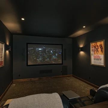 Media Room Curtains Home Theaters, Black Wall Movie Room, All Black Media Room, Movie Theater Paint Colors, Black Home Theater Room, Home Theatre Painting Ideas, Home Theater Accent Wall, Theatre Living Room Ideas, Accent Wall Movie Room