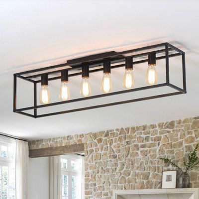 6 lights cage style kitchen island ceiling light, it has a rectangular steel frame that comes in a matte black or black with gold finish for a modern farmhouse look we love. It is a special design for low purposely designed for low-rise ceiling houses, which is popular for your kitchen island, dining room table, rectangular coffee table, bedroom, foyer, entryway, etc. As a perfect mix of function and aesthetics with a unique look, the kitchen chandelier is sure to impress! | 17 Stories 6 Lights Dining Room Light Low Ceiling, Dining Room Table Light Fixture, Kitchen Island Ceiling, Style Kitchen Island, Island Ceiling Light, Coffee Table Bedroom, Kitchen Island Dining Room, Island Dining Room, Farmhouse Kitchen Lighting