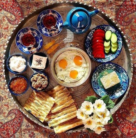 Persian Food + Persian Breakfast They say breakfast is the most important meal of the day, and Iranians don’t take this lightly. From the types of bread, to the heavy meat dishes and tea etiquette, we break down how to eat breakfast like an Iranian to help you fit right in with the locals.! Arabic Breakfast, Arabisk Mat, Persian Food Iranian Cuisine, Different Types Of Food, Iran Food, Iranian Cuisine, Turkish Breakfast, Breakfast Platter, Persian Cuisine