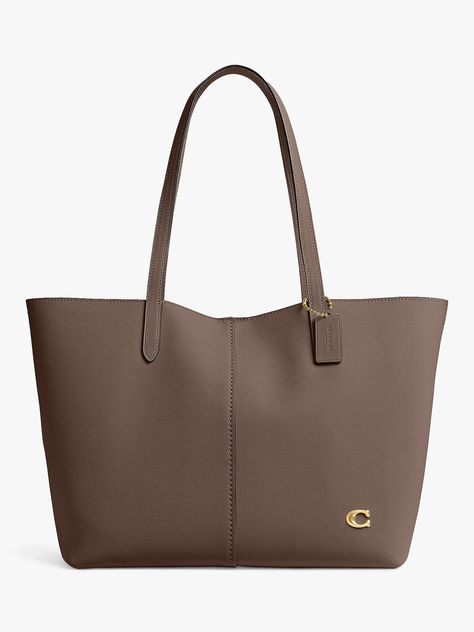 Sticking to the same large, boxy shape, this tote has been reimagined by Coach. Crafted from leather that'll last for years to come, it secures with a magnetic closure. Coach School Bag, Coach Bags Tote, Bags For University For Women, Bags For Uni, Coach Shopping Bag, School Tote Bags, School Handbags, School Handbag, Handbag For School