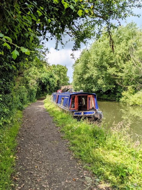 Blue narrowboat moored on a quiet towpath surrounded by trees Canal Aesthetic, Boat Holiday, Narrow Boat, Uk Weather, Holiday Storage, Packing Guide, Boat Life, Holiday Packing, Boat House