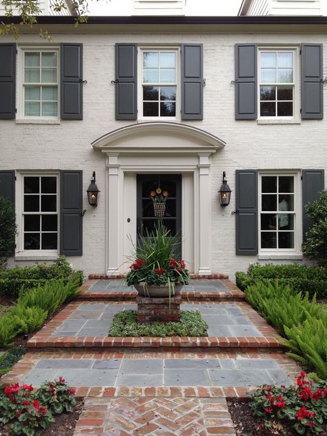 Southern White Brick House, Taupe House Black Shutters, Colonial Awning Front Porches, Painted Brick House With Shutters, Painted Brick Colonial Exterior, Exterior Door And Shutter Color Ideas, Tan Shutters Brick House, Beige House Black Trim Exterior, Exterior House Colors With Shutters Paint Ideas