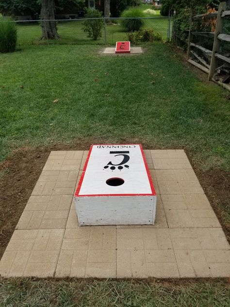 Back yard cornhole Corn Hole Playing Area, Corn Hole Yard Ideas, Cornhole Area Ideas, Backyard Cornhole Ideas, Corn Hole Backyard Set Up, Cornhole Landscaping, Cornhole Backyard Setup, Cornhole Playing Area, Cornhole Court Backyard Ideas