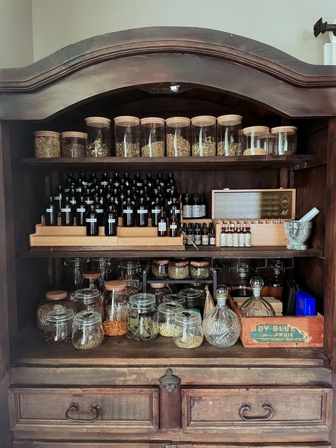 How To Build An Apothecary Cabinet, Apothecary Herb Storage, Home Apothecary Cabinet, Home Apothecary Aesthetic, Herbalist Kitchen Decor, Herbalist Shelves, Herb Medicine Cabinet, Apothecary Shelves Display, Apothecary Organization Ideas