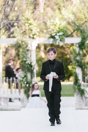 Ring Bearer in Black Tuxedo %26 Black Shirt Photography: Amy %26 Stuart Photography Read More: http://www.insideweddings.com/weddings/cheryl-burke-and-matthew-lawrence/1358/ Black Tuxedo Black Shirt, Ring Bearer Outfit Black, Black Ring Bearer, Matthew Lawrence, Shirt Photography, Cheryl Burke, Photo Ring, Bearer Outfit, Tuxedo Black