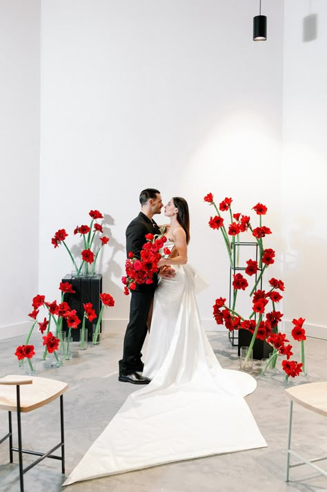 Red Wedding Accents, Couples Embracing, Bouquet With Ranunculus, Black Columns, Hyde House, Tampa Wedding Venue, All Black Suit, Red Amaryllis, Modern Wedding Ceremony