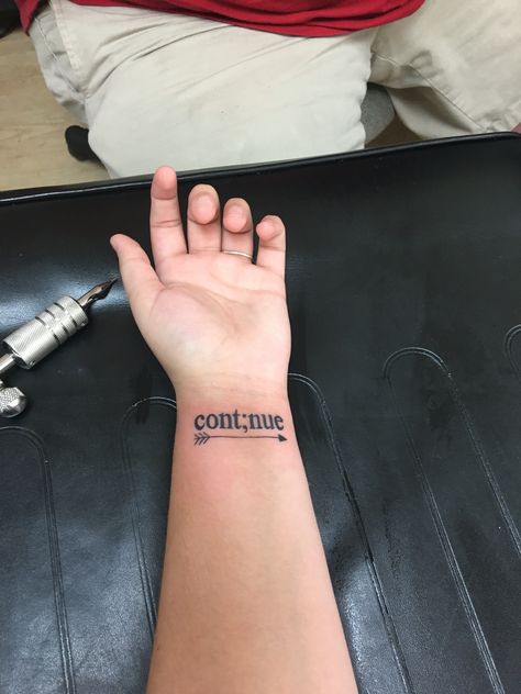 Just got my first tattoo, in love!! "Continue" to never give up and to keep moving forward ";" to represent that my story isn't over yet And the arrow means that life may hold you back with bad things but once you let them go you'll be free Keep Holding On Tattoo, You’ll Get Over It Tattoo, Continue Tattoo Ideas, To Be Continued Tattoo, My Story Isnt Over Tattoo, Small First Tattoo Ideas Meaningful, Cont;nue Tattoo, Keep Going Tattoos Symbol, Be Free Tattoo