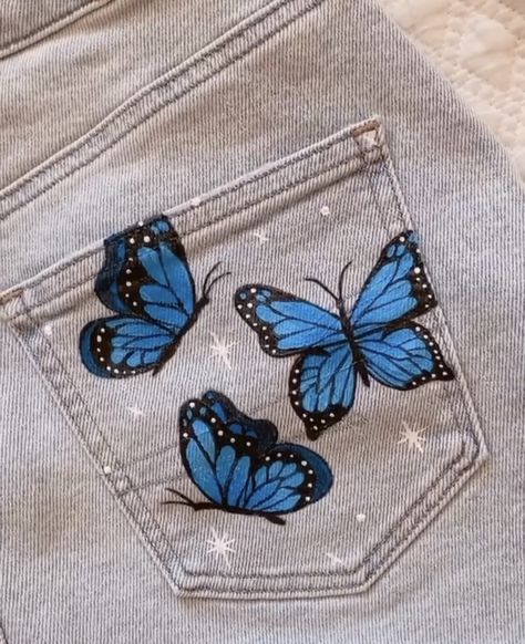 Butterfly Painted Jeans, Art On Jeans Pants, Painting Ideas On Jeans Pants, Painted Pants Idea, Painted Denim Jacket Ideas, Painting On Jeans Ideas, Things To Paint On Jeans, Hand Painted Jeans, Custom Jeans Diy