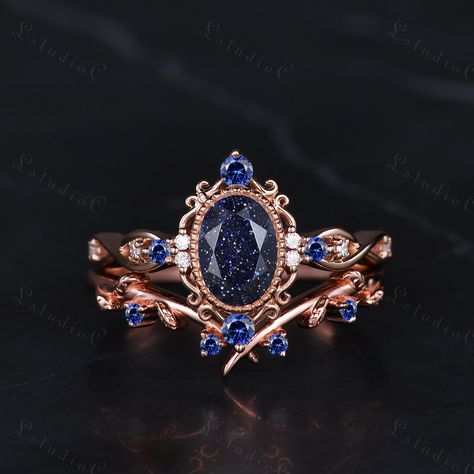 5x7mm Filigree Oval Blue Sandstone Bridal Ring Set Vintage Sapphire Leaf Engagement Ring Art Deco Women Promise Anniversary Ring Unique Gift Side stones: blue sapphire and moissanite This ring can also be made in genuine solid 10k, 14k, 18k gold or Platinum, and all the rings in my shop can be customized too! If you want to know more details about the ring, just contact with me anytime! If you want to customize the ring, just contact with me anytime! If you want to make a custom jewelry, just contact with me anytime! PROCESS TIME AND SHIPPING It usually takes about 3-4 weeks to finish the ring and 4-6 days to deliver to you if you are in US. (Free Shipping within US!) We will offer you the tracking number once your ring is shipped. WARRANTY 30 days money back guarantee! If you have any que Moissanite Sapphire Ring, Blue Goldstone Ring, Starry Rings, Moth Wedding, Vintage Sapphire Engagement Rings, Wedding Ring Sapphire, Fairytale Engagement Rings, Blue Sandstone Ring, Blue Sandstone Engagement Ring