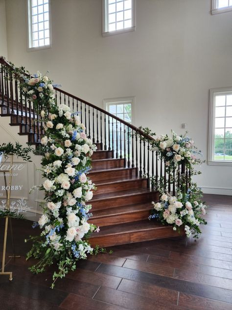 White, blue and blush floral staircase at the Milestone Mansion. Stairway Florals Wedding, Flowers On Staircase Wedding, Floral Staircase Wedding, Staircase Flowers Wedding, Flowers Staircase, Ceremony Meadow, Decorated Staircase, Stairs Flowers, Wedding Staircase Decoration