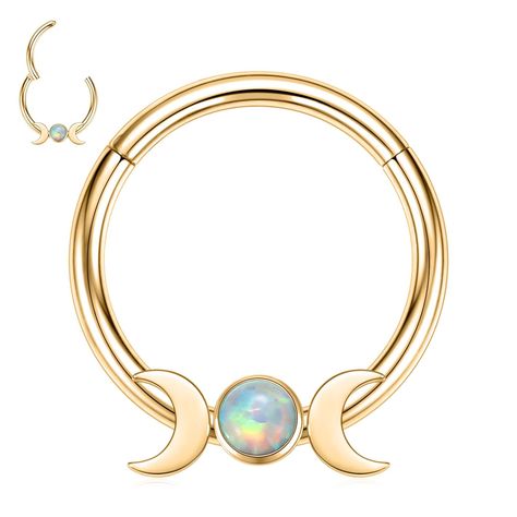 PRICES MAY VARY. 【Stylish Design】This septum clicker ring has moon and opal at the bottom,which makes this septum clicker ring is more shiny and cuter.Wearing it will make you different from the crowd. 【Color&Size】Color:Gold.Size:16G(thickness:1.2mm);inner diameter:8mm.Please check thickness and inner diameter carefully.Select most suitable size for yourself.If you don't know the size,please refer to the size chart or please feel free to contact us ,we will do our best to help you. 【Safe Materia Moon Septum Ring, Lobe Piercing Jewelry, Stacked Septum, Gold Septum Piercing, Earrings Conch, Girly Christmas Gifts, Gold Septum, Daith Jewelry, Girly Christmas