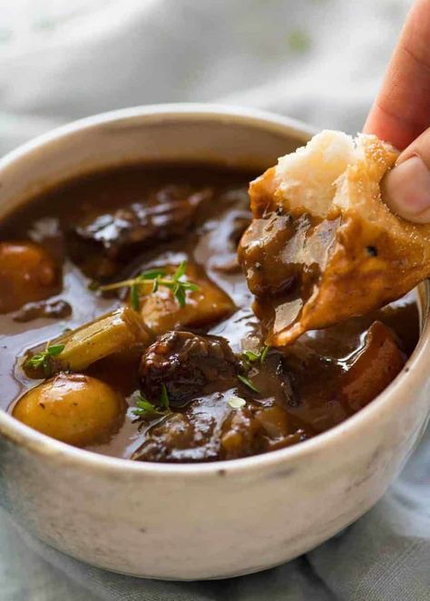 Close up photo of a piece of bread being dunked into Beef Stew with Potatoes and Carrots. The bread shows how thick the gravy sauce is./ Beef Stew With Potatoes, Beef Stew Dinner, Stew With Potatoes, Beef Stews, Cozy Soups, Comfy Food, Beef And Potato Stew, Classic Beef Stew, Sweet Potato Recipe