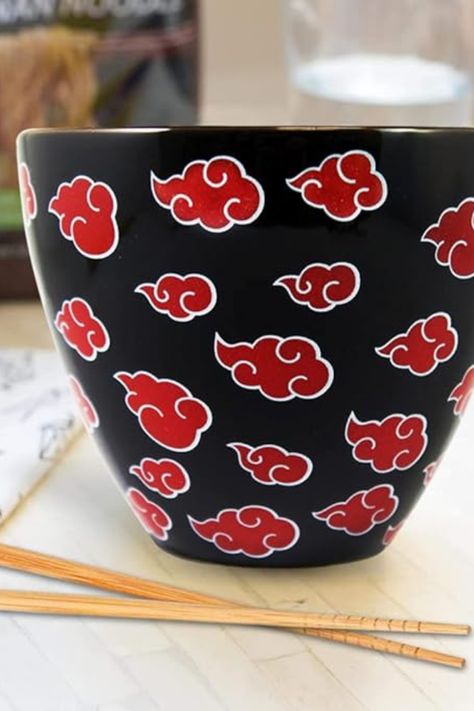 "Elevate your dining experience with the JUST FUNKY Naruto Shippuden Ramen Bowl! 🍜 Featuring the iconic Akatsuki Cloud Symbol and paired with Anime Chopsticks, this 16 oz Ceramic Soup Mug is a must-have for Naruto fans. Upgrade your kitchen decor with this officially licensed masterpiece. Get yours now! 🥢🍥 #NarutoRamenBowl #Akatsuki #AnimeKitchen" Anime Pottery Painting Ideas, Anime Ceramics Ideas, Anime Chopsticks, Anime Pottery, Ramen Bowl Ceramic, Naruto Ichiraku Ramen, Cloud Symbol, Ichiraku Ramen Shop, Ceramic Ramen Bowl