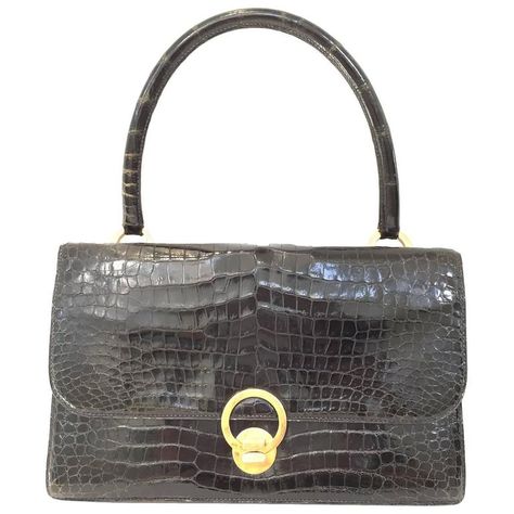 Vintage  Hermes crocodile purse | From a collection of rare vintage evening bags and minaudières at https://www.1stdibs.com/fashion/handbags-purses-bags/evening-bags-minaudieres/ Vintage Hermes Bag, Hermes Crocodile, Crocodile Purse, Alligator Handbags, Hermes Vintage, Crocodile Handbags, Vintage Leather Handbag, Vintage Evening Bags, Vintage Tote Bag