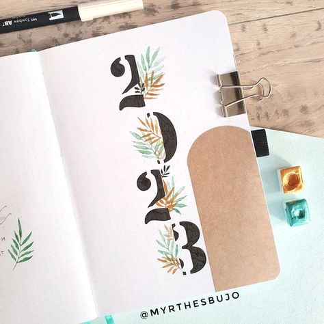 Myrthe | Bullet journal 💕 on Instagram: "2023 set up. Is your bullet journal ready for 2023? • Theme inspired by @bloomanddot and @inprint.xyz • • • • • #bujo #bulletjournalcommunity #bulletjournalcover #bujogirl #bujoaddict #bulletjournal #bujoaddict #bujocommunity #bujoinspiration #plannerinspo #plannercommunity #bujosetup #bujo2023 #planwithme #planneraddict" Word For 2023, Bullet Journal Front Page, 2023 Bujo, Welcome 2023, Bullet Journal Month, Bullet Journal Set Up, Bullet Journal Ideas Templates, Creating A Bullet Journal, Bullet Journal Cover Page