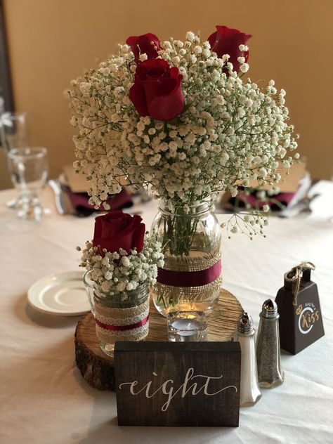 Baby’s breath with different size mason jars on the wood plaque. Red Rose Centerpiece, Wedding Table Centerpieces Rustic, Red Roses Centerpieces, Burgundy Wedding Centerpieces, Creative Wedding Centerpieces, Rose Centerpiece, Wedding Centerpieces Mason Jars, Rose Centerpieces, Mason Jar Wedding