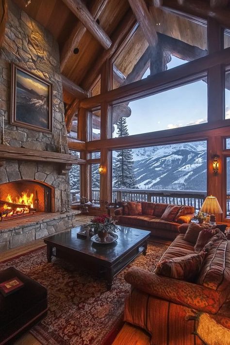 Luxury Mountain Lodge With a Grand Stone Fireplace in the Great Room stunning winter mountain views. Check out and drool over all of these enchanting mountain homes with stone fireplaces–the ultimate cozy and rustic retreats. Mountain Dream Homes Interior, Storm Mountain Lodge, Mountain Home Great Room, Mountain Lodge Aesthetic, Winter Lodge Interior, Mountain Lodge Interior Design, Luxury Cozy Living Room, Ski Lodge House, Mountain Top House