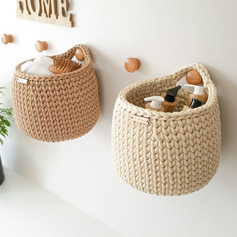 Introducing our beautiful hanging wall basket! This unique crochet basket is the perfect addition to your home decor. Hang it on any wall for an instant upgrade to your space.

#crochethangingbasket #wallbasket #hanging basket #hanging walldecor Hanging Baskets Nursery, Crochet Wall Decoration, Nursery Crochet Ideas, Crochet Organizer Storage Ideas, Nursery Wall Storage, Crochet Hanging Baskets, Crochet Hanging Basket, Crochet Storage Basket, Hanging Basket Storage