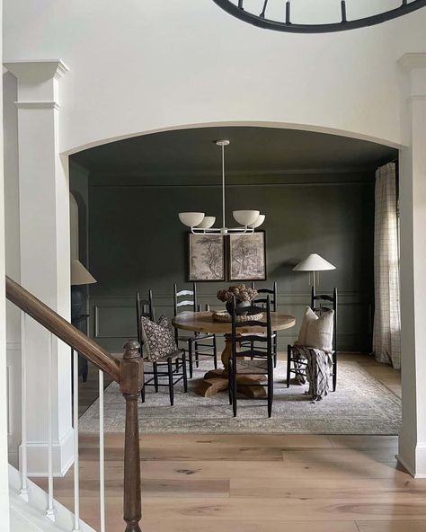 32 Elegant Dark Green Walls for a Modern Aesthetic Green Dining Room Walls, Black And White Dining Room, Round Wooden Table, Picture Frame Wainscoting, Neutral Dining Room, Olive Green Walls, Green Accent Walls, Green Dining Room, Dark Green Walls