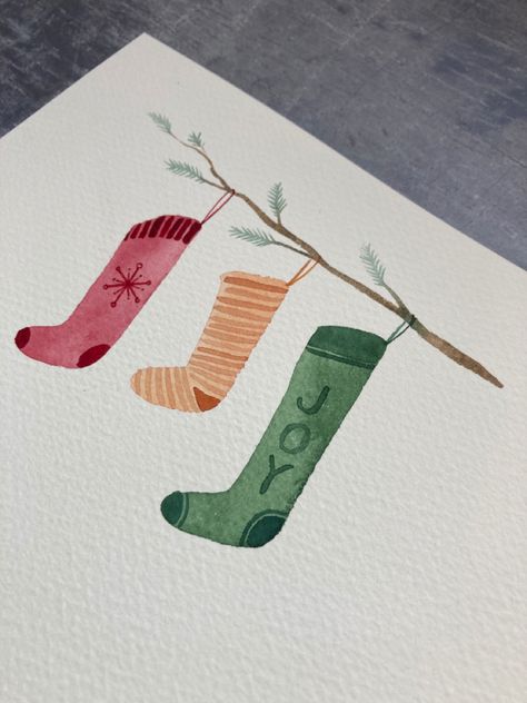 Learn to paint these lovely watercolour Christmas eve stockings. Perfect for beginners, learn to paint with Harriet de Winton on the de Winton Paper co. Youtube channel by clicking the link! #christmasstocking #christmasstockingtutorial #youtubewatercolour #watercolor #christmaswatercolourideas #christmascraftsforkids #christmascraftideas #christmaswatercolor Watercolour Christmas Stocking, Christmas Cards Painting Ideas, Cute Watercolour Christmas Card, Stocking Drawing Christmas, Christmas Painting Inspiration, Cute Watercolour Christmas Cards, Christmas Stockings Watercolor, Beginner Christmas Watercolor, Watercolor Card Christmas