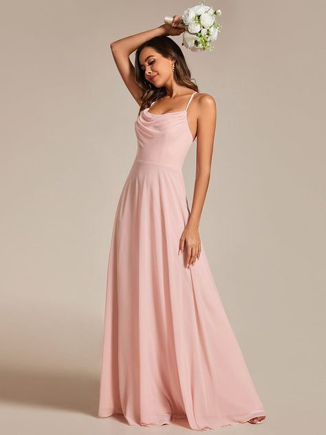 Grace the aisle in our Flowy Back Criss-Cross Swing Collar Sleeveless A-Line Bridesmaid Dress. The swing collar and sleeveless design exude modern charm, while the criss-cross back detailing adds a touch of sophistication. With a flowing A-line silhouette, this bridesmaid dress combines elegance with comfort, ensuring a memorable celebration. Fit: Please refer to size chart. Length: Floor Length. Sleeve Style: Sleeveless. Closure: It is concealed a zipper up the back. Undergarments: It is padded Pastel Pink Bridesmaid Dresses Long, Wessing Dresses, Spaghetti Strap Bridesmaid Dress, Pink Bridesmaid Gowns, Bridesmaid Gown Chiffon, Spaghetti Strap Bridesmaids Dresses, Dresses Flowy, Pink Bridesmaid Dresses, Dress Flowy