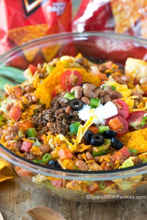 Dorito Taco Salad is a great potluck recipe with seasoned ground beef, lettuce, pinto beans veggies and Doritos all sauced up with a zingy dressing. Dorito Taco Salad, Dorito Taco Salad Recipe, Best Potluck Dishes, Dorito Taco, Frito Corn Salad, My Heavenly Recipes, Taco Salad Doritos, Taco Salat, Heavenly Recipes