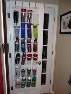 Storing water bottles and insulated coffee cups Spinning our Webb....One Day at a Time: My Cup Runeth Over and then Some.... Storing Water Bottles, Coffee Cup Storage, Camping Gear Storage, Mug Storage, Water Bottle Storage, Travel Hacks Packing, Shoe Holders, Ideas Para Organizar, Pantry Door