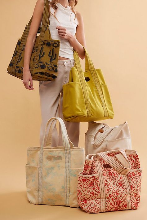 Carry it all in this roomy tote, featured in a classic canvas fabrication with built-it top handles and contrast-seamed shoulder straps. **Features:** Tote style, canvas fabrication, spacious interior, 3 exterior pockets, built-in top handles, contrast-seamed shoulder straps **Why We | Caravan Canvas Tote Bag by FP Collection at Free People in Yellow Patchwork Tote Bags, People Logo, Diy Bags Patterns, Textile Bag, Tote Bags Sewing, Fabric Tote, Tote Pattern, Tote Bag Pattern, Denim Bag