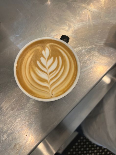 Latte art that’s being created with milk, and a shot of expresso, which crated a beautiful flower at a cafe. Working At Cafe, Swan Latte Art, Latte Art Aesthetic, Cafes Aesthetic, Coffee Cafe Aesthetic, Nyc Cafe, Café Aesthetic, Ice Aesthetic, City Cafe