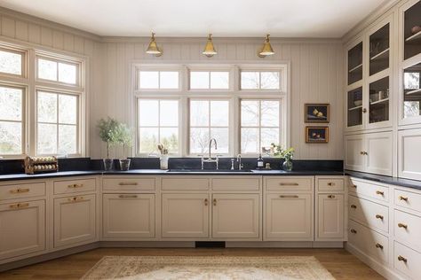 Stoffer Home Cabinetry on Instagram: "The #JSDhoneycreek project captures a few of the details we offer within our tailored line of cabinetry. Can you spot the hidden dishwasher and brass strip on the trash pull out? #mystofferhomecabinetrystyle . Finish: Bromley Taupe Design: @jeanstofferdesign Hardware, lighting, accessories: @stofferhome Photography: @stofferphotographyinteriors" Stoffer Home Kitchen, Stoffer Kitchen, Jean Stoffer Kitchen, Light Gray Kitchen, Jean Stoffer Design, Stoffer Home, Light Grey Kitchen Cabinets, Jean Stoffer, Kitchen Window Design