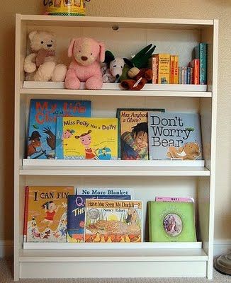 We made this children's book rack by adding a bar on each shelf, so that the books can be displayed facing front. This is an inexpensive Billy bookshelf from Ikea ($40). And the bars are mouldings purchased from Lowes (about $5 total).  I could display dishes like this too! Bookshelf Ikea, Front Facing Bookshelf, Billy Regal, Ikea Billy Bookcase Hack, Montessori Room, Ikea Bookshelves, Ikea Billy Bookcase, Ikea Billy, Billy Bookcase