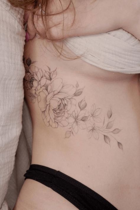 39 Peony Tattoo Design Ideas You Don't Want To Miss Peony Vine Tattoo, Peony And Hummingbird Tattoo, Peony Rib Tattoo, Peony Thigh Tattoos Women, Peony Tattoo Hip, Rose And Peony Tattoo, Dainty Peony Tattoo, Delicate Peony Tattoo, Peony Fine Line Tattoo