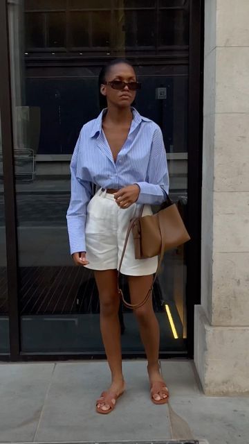 Fabiana | Minimal Streetstyle on Instagram: "bringing this one back 🤍 full outfit linked on stories and in outfit links 3 highlights x •• • • • #fashioneducation #hm #blazeroutfit #fashionhacks #howtostyle #perfectfit #cleangirl #cleangirlaesthetic #springfashion #stylereels #cargo #educationalreels #howtostyle #springoutfit #springoutfits #outfitidea #springoutfitideas #lessiswore10k #lessiswore #oversizedblazer #fashionhaul #newinfashion linen shorts striped blue shirt oversized streetstyle Blue Linen Shorts Outfit Summer, Linen Shorts Outfit Spring, Blue Stripped Shirt Outfit Women Work, Poplin Shorts Outfit Women, Striped Linen Shirt Outfit Women, Striped Poplin Shirt Outfit, Blue Poplin Shirt Outfit, Blue Pin Stripe Shirt Outfit, Blue Linen Shorts Outfit