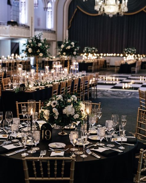 A Midnight Kiss at a Boston New Year’s Eve Wedding✨ Alie and Zach’s winter wedding theme of elegant, moody, classic glam was beautifully brought to life by @bameventsbos. The sophisticated color palette, enriched with gold accents and abundant candlelight, perfectly matched their vision. The photos by @cityluxstudios not only captured the couple’s happiness and the venue’s grandeur but also added a timeless elegance with black-and-white images that embodied the glam of their New Year’s Eve c... Black And White Color Scheme Wedding, Silver And Gold Winter Wedding, New Years Day Wedding Ideas, Winter Wedding Glam, Black Tie New Years Eve Wedding, Classy Black And White Wedding Decor, Black And White Ballroom Wedding, Black Gold White Wedding Decoration, Black Out Wedding Theme