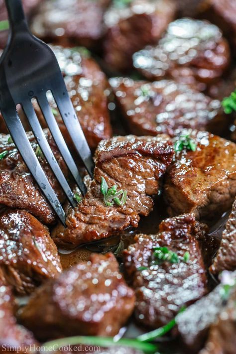 These Garlic Butter Steak Bites are so savory, juicy, and delicious. Each steak bite is crusted in a cast iron pan and basted with garlic butter and fresh herbs. #garlicbuttersteakbites #steakbites #garlicherbsteakbites #garlicbuttersteakbitesrecipe Garlic Herb Steak, Braised Beef Recipes, Cast Iron Steak, Garlic Butter Steak Bites, Butter Steak Bites, Ribeye Steak Recipes, Steak Bites Recipe, Garlic Steak, Steak Tips