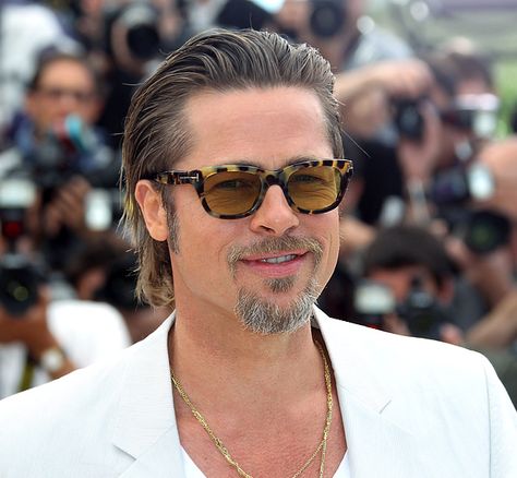 May 16, 2011: Slicked back! At a Tree of Life screening, Pitt slicked back his hair and rocked some serious sideburns. Brad Pitt Hair, Hair Evolution, Beard Look, Slicked Back Hair, Tom Ford Sunglasses, Handsome Actors, Long Hair Styles Men, Angelina Jolie, Brad Pitt