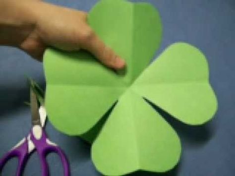 In this tutorial, we learn how to make a four leaf clover pattern. First, fold your paper in half, then fold it in half in the other direction. Next, fold the edges making a point and then cut a half an inch along the edge, making a cone shape. end the shape on the right side, making a heart shape. When you unfold, you will have a four leaf clover! You can use any size of paper to make this, just make sure you use green paper to keep the theme Irish. This is a great project for kids to learn ... Clover Craft, St Patricks Crafts, Clover Pattern, St Patrick's Day Crafts, St Paddys Day, Paper Flowers Diy, Construction Paper, St Pattys Day, Paper Cutout