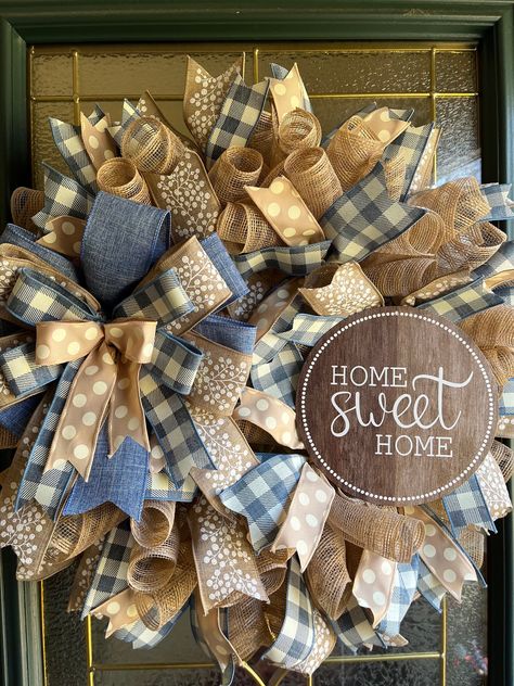 Beautiful Farmhouse rustic country style wreath that can be displayed on a front door, wall, interior door, or over a fireplace mantel. Beige deco mesh, denim blue and ivory checked wired ribbon, solid denim blue wired ribbon, beige with white berries wired ribbon, beige and ivory polka dot wired ribbon, matching ribbon bow, and a Home Sweet Home metal sign are securely attached to a wire frame made to last for years to come. Makes a great gift for a birthday, housewarming, or any occasion. All Big Wreath, Diy Deco Mesh Wreath, Fall Mesh Wreaths, Mesh Ribbon Wreaths, Farmhouse Style Wreath, Home Wreath, White Berries, Mantel Beige, All Season Wreath