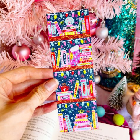 The design for this bookmark was illustrated by me and inspired by my love for books! The illustration is then printed and made into this beautiful bookmark! ✦ DETAILS ✦• Size: 2" x 6"• Material: Heavyweight Matte Cardstock (Not Laminated)• Logo on the back Copyright ©2022 Emily Cromwell Designs Merry Bookmas, Bookshelf Bookmark, Christmas Bookshelf, Bookish Christmas, Art Bookmarks, Calligraphy Doodles, Christmas Bookmarks, Christmas Coloring Books, Cottage Christmas