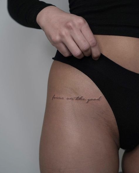 Hip Word Tattoos Women, Upper Thigh Word Tattoo, Script Hip Tattoo, Side Hip Tattoos Women Quotes, Hip Quote Tattoo, Small Text Tattoos For Women, Upper Hip Tattoos Women, Focus On The Good Tattoo, Aesthetic Tattoo Arm