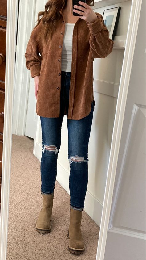 Brown corduroy shacket, white tank top, skinny jeans, taupe chelsea boots •Carmel corduroy shirt •shacket •distressed jeans •beige chelsea boots •Fall outfit Oversized Brown Shacket Outfit, Brown Corduroy Jacket Outfit Fall, Black Corduroy Shacket Outfit, How To Style A Corduroy Shacket, Shacket And Chelsea Boots, Fall Outfits With Button Up Shirts, Fall Corduroy Jacket Outfit, Brown Shirt Jeans Outfit, Fall Jeans Outfit Casual Ankle Boots