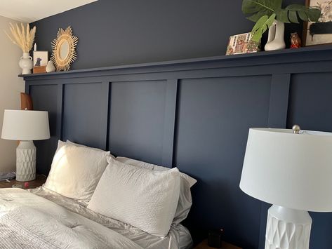 Headboard And Wall Same Color, Molding Headboard Wall, Shelf Above Board And Batten, Bedroom Panneling With Picture Rail, Panelled Wall Behind Bed, Dark Green Bedroom Panneling, Board And Batten Shelf Decor, High Wainscoting Bedroom, Applied Molding On Walls Bedroom