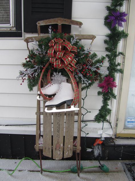 Sled Ideas For Christmas, Christmas Sleds Decorated, Sled For Christmas Decor, Old Sleds Decorated For Christmas, Sled Christmas Decor Porch Ideas, Sled With Ice Skates Christmas Decor, Sled Decorating Ideas Diy, Sled With Skates Decoration, Antique Sleds Decorated For Christmas