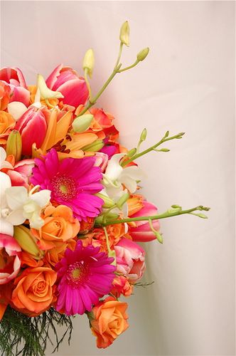 orange roses, pink gerbers, white starflower bouquet Pink And Orange Wedding Theme Groomsmen, Pink And Orange Decorations, Pink And Orange Beach Wedding, Orange And Pink Bouquet, Pink Orange Yellow Wedding Flowers, Pink Orange And White Bridal Bouquet, Pink And Orange Bouquet, Orange And Pink Roses Bouquet, Pink Yellow Orange Wedding Bouquet